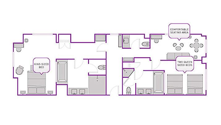 A bedroom with two queen-size beds in The Cosmopolitan City Suite.